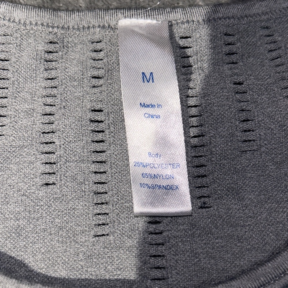 This is a workout shirt, size medium color is grey and black. - Picture 2 of 4